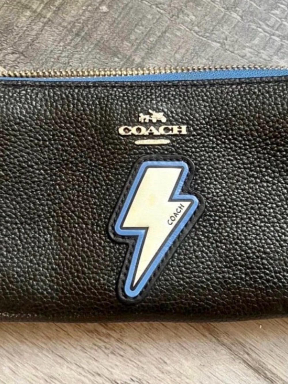 Coach Black Pebbled Leather Wristlet with Blue and White Lightning Patch